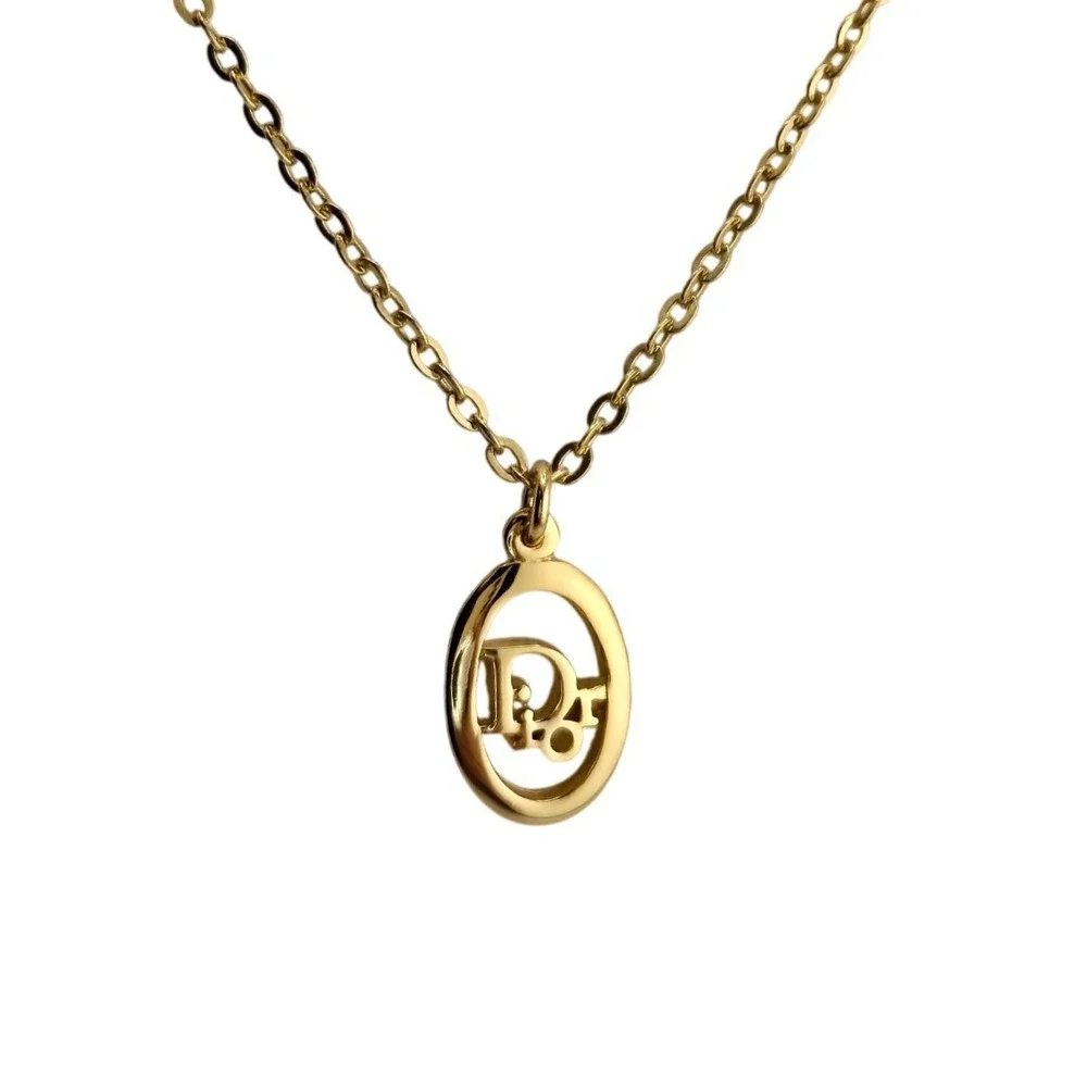 Christian Dior Gold Tone Oval Logo Pendant Necklace Adjustable Chain Vintage
